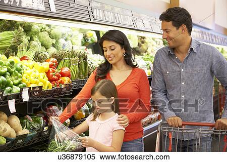 Stock Photography - Family shopping in supermarket. Fotosearch