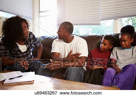 Family Sitting On Sofa With Parents Arguing View Large Photo Image Stock Photo - Family Sitting On Sofa With Parents Arguing. Fotosearch