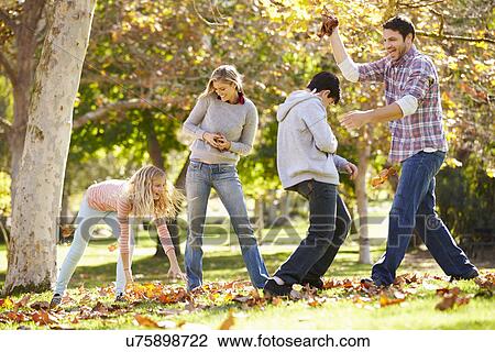 Family Throwing Autumn Leaves In The Air View Large Photo Image Stock Image - Family Throwing Autumn Leaves In The Air. Fotosearch