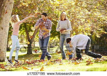 Family Throwing Autumn Leaves In The Air View Large Photo Image Stock Photography - Family Throwing Autumn Leaves In The Air. Fotosearch