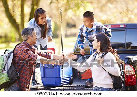 Family Unpacking Pick Up Truck On Camping Holiday View Large Photo Image Stock Image - Family Unpacking Pick Up Truck On Camping Holiday. Fotosearch