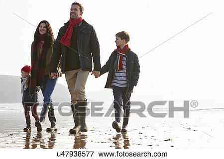 Family Walking Along Winter Beach View Large Photo Image Stock Photo - Family Walking Along Winter Beach. Fotosearch
