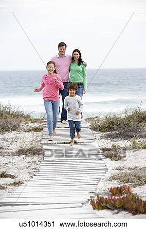 Family walking by the sea View Large Photo Image Stock Image - Family walking by the sea. Fotosearch