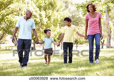 Family walking in park View Large Photo Image Stock Photo - Family walking in park. Fotosearch