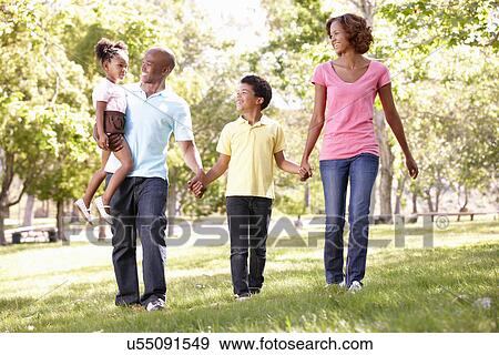 Family walking in park View Large Photo Image Stock Photo - Family walking in park. Fotosearch