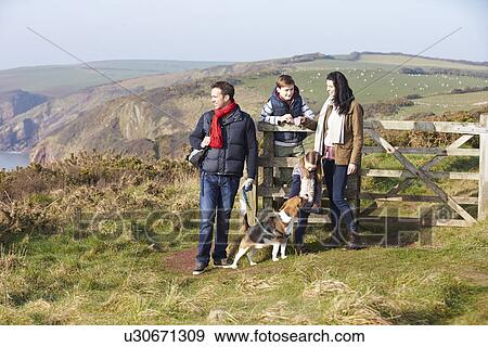 Family With Dog Walking Along Coastal Path View Large Photo Image Stock Photo - Family With Dog Walking Along Coastal Path. Fotosearch