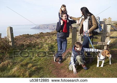 Family With Dog Walking Along Coastal Path View Large Photo Image Stock Photography - Family With Dog Walking Along Coastal Path. Fotosearch