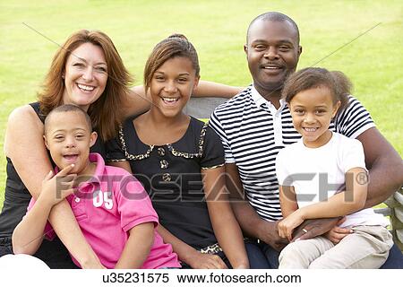 Family with Downs Syndrome son View Large Photo Image Stock Photography - Family with Downs Syndrome son. Fotosearch