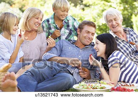 Family with picnic in park View Large Photo Image Stock Image - Family with picnic in park. Fotosearch