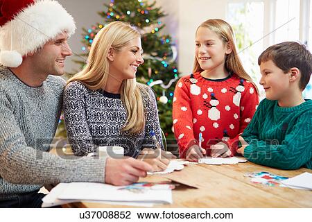 Family Writing Christmas Cards Together View Large Photo Image Stock Image - Family Writing Christmas Cards Together. Fotosearch