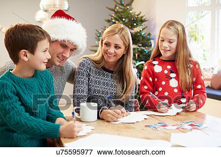 Family Writing Christmas Cards Together View Large Photo Image Stock Photo - Family Writing Christmas Cards Together. Fotosearch