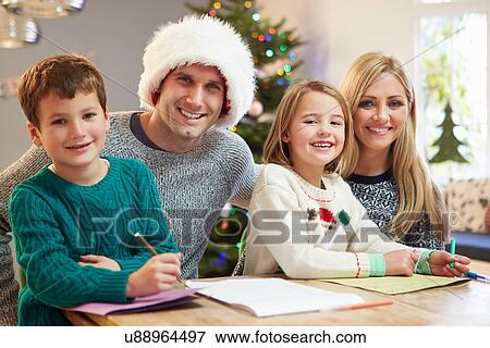Family Writing Christmas Cards Together View Large Photo Image Stock Photo - Family Writing Christmas Cards Together. Fotosearch