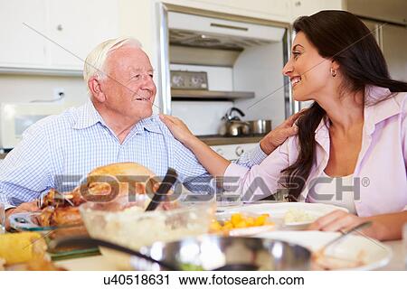 Father And Adult Daughter Having Family Meal At Table View Large Photo Image Stock Image - Father And Adult Daughter Having Family Meal At Table. Fotosearch