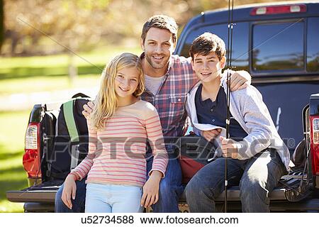 Father And Children Sitting In Truck On Camping Holiday View Large Photo Image Stock Photo - Father And Children Sitting In Truck On Camping Holiday. Fotosearch