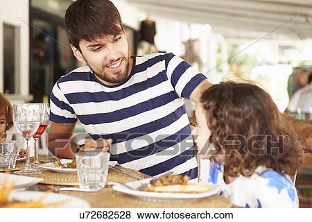 Father And Daughter Enjoying Meal In Restaurant View Large Photo Image Stock Photo - Father And Daughter Enjoying Meal In Restaurant. Fotosearch