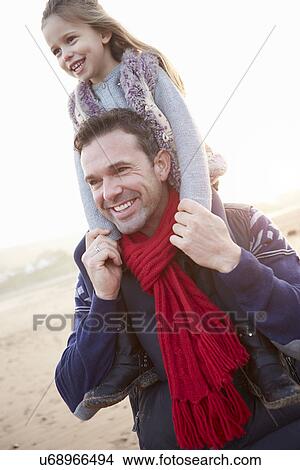Father And Daughter Walking On Winter Beach View Large Photo Image Picture - Father And Daughter Walking On Winter Beach. Fotosearch