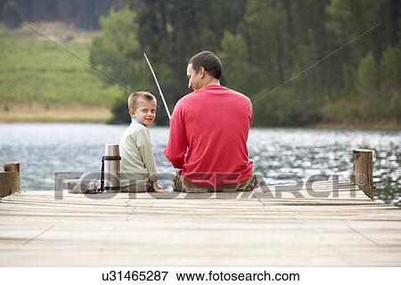 Stock Photo - Father and son fishing. Fotosearch