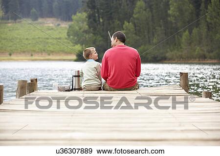Father and son fishing View Large Photo Image Stock Photo - Father and son fishing. Fotosearch