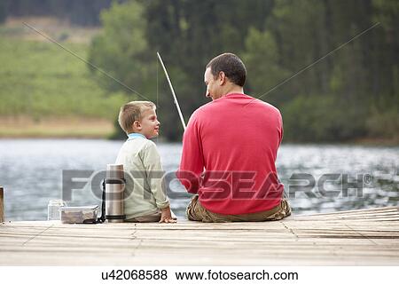 Father and son fishing View Large Photo Image Stock Photo - Father and son fishing. Fotosearch