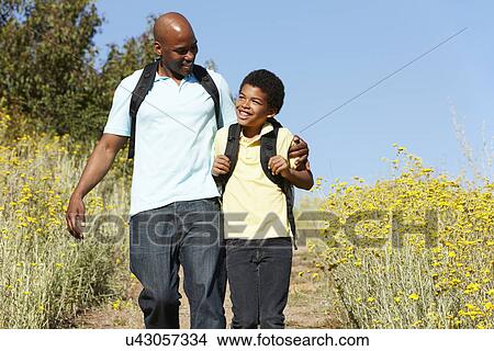Father and son on country hike View Large Photo Image Picture - Father and son on country hike. Fotosearch