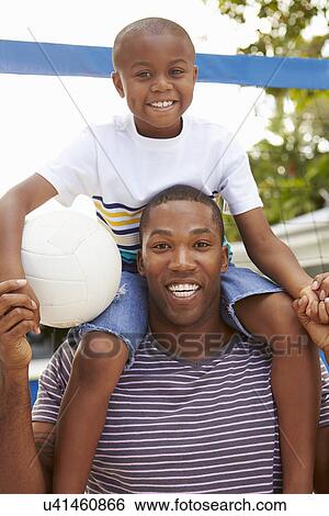 Father And Son Playing Game Of Volleyball In Garden View Large Photo Image Stock Photograph - Father And Son Playing Game Of Volleyball In Garden . Fotosearch