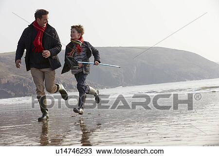 Father And Son Running On Winter Beach With Fishing Net View Large Photo Image Stock Image - Father And Son Running On Winter Beach With Fishing Net. Fotosearch