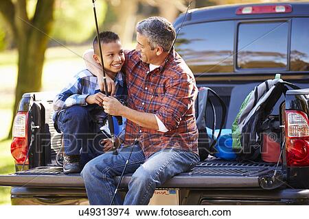 Father And Son Sitting In Pick Up Truck On Camping Holiday View Large Photo Image Picture - Father And Son Sitting In Pick Up Truck On Camping Holiday. Fotosearch
