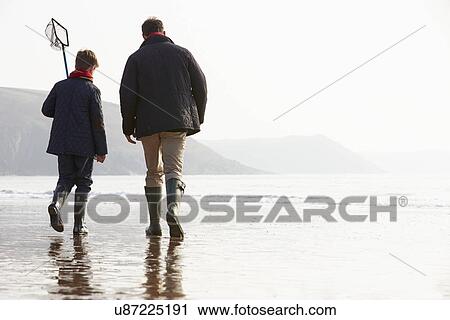 Father And Son Walking On Winter Beach With Fishing Net View Large Photo Image Stock Image - Father And Son Walking On Winter Beach With Fishing Net. Fotosearch