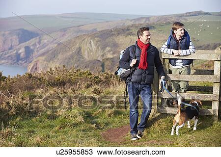Father And Son With Dog Walking Along Coastal Path View Large Photo Image Stock Image - Father And Son With Dog Walking Along Coastal Path. Fotosearch