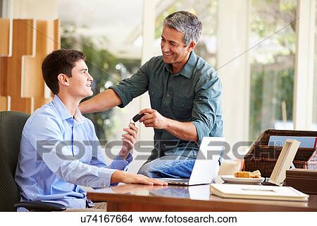 Father Giving Teenage Son Car Keys View Large Photo Image Picture - Father Giving Teenage Son Car Keys. Fotosearch