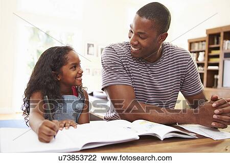 Father Helping Daughter With Homework View Large Photo Image Stock Image - Father Helping Daughter With Homework. Fotosearch