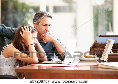 Father Helping Stressed Teenage Daughter Looking At Laptop View Large Photo Image Stock Photo - Father Helping Stressed Teenage Daughter Looking At Laptop. Fotosearch