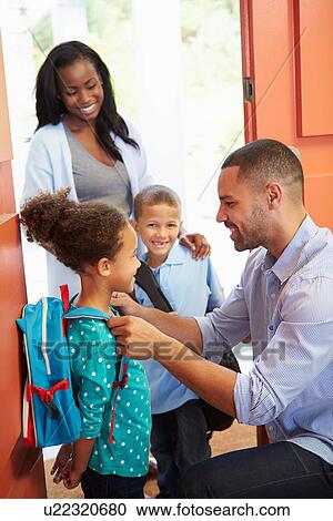 Father Saying Goodbye To Children As They Leave For School View Large Photo Image Stock Image - Father Saying Goodbye To Children As They Leave For School. Fotosearch