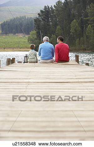 Stock Photo - Father, son and grandfather fishing. Fotosearch