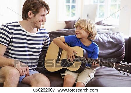 Father Teaching Son To Play Guitar View Large Photo Image Stock Photo - Father Teaching Son To Play Guitar. Fotosearch