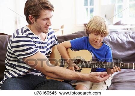 Father Teaching Son To Play Guitar View Large Photo Image Stock Photography - Father Teaching Son To Play Guitar. Fotosearch