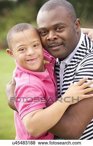Father with Downs Syndrome son View Large Photo Image Stock Photo - Father with Downs Syndrome son. Fotosearch
