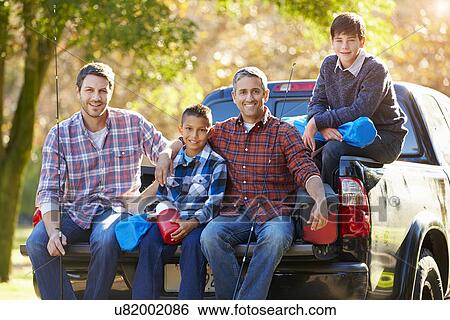 Fathers With Sons Sitting In Truck On Camping Holiday View Large Photo Image Stock Photograph - Fathers With Sons Sitting In Truck On Camping Holiday. Fotosearch
