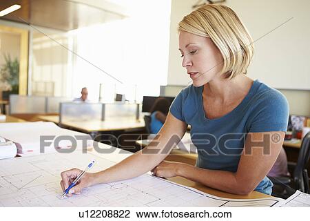 Female Architect Studying Plans In Office View Large Photo Image Stock Image - Female Architect Studying Plans In Office. Fotosearch
