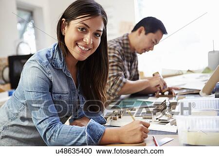 Female Architect Working On Model In Office View Large Photo Image Stock Image - Female Architect Working On Model In Office. Fotosearch