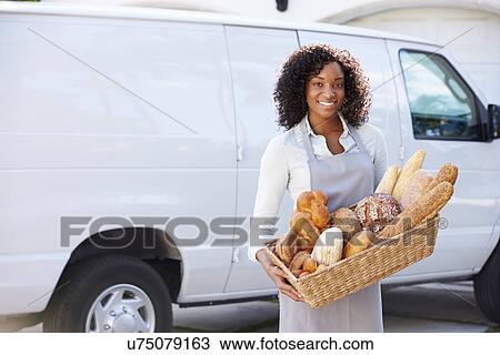Female Baker Delivering Bread Standing In Front Of Van View Large Photo Image Stock Image - Female Baker Delivering Bread Standing In Front Of Van. Fotosearch