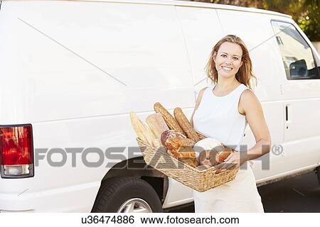Female Baker Delivering Bread Standing In Front Of Van View Large Photo Image Stock Photograph - Female Baker Delivering Bread Standing In Front Of Van. Fotosearch