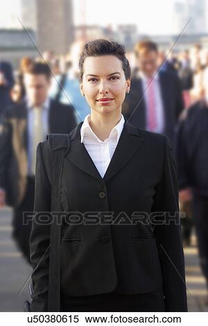 Female commuter in crowd View Large Photo Image Stock Photography - Female commuter in crowd. Fotosearch