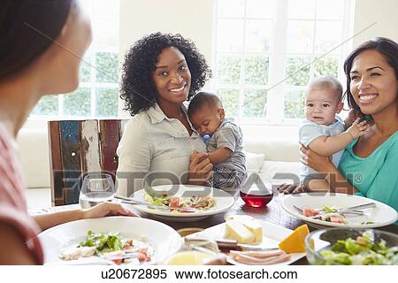 Female Friends With Babies Enjoying Meal At Home Together View Large Photo Image Stock Photography - Female Friends With Babies Enjoying Meal At Home Together. Fotosearch