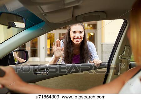 Stock Photo - Female High School Student Being Dropped At School By Parent. Fotosearch