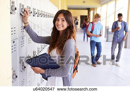Female High School Student Opening Locker View Large Photo Image Stock Photo - Female High School Student Opening Locker. Fotosearch