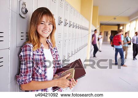 Female High School Student Standing By Lockers View Large Photo Image Stock Image - Female High School Student Standing By Lockers. Fotosearch