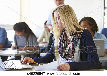 Female High School Student Using Laptop In Class View Large Photo Image Stock Photo - Female High School Student Using Laptop In Class. Fotosearch