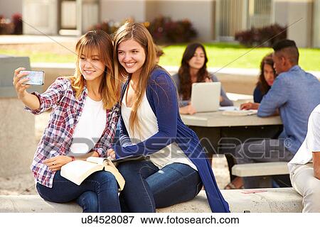 Female High School Students Taking Selfie On Campus View Large Photo Image Stock Photo - Female High School Students Taking Selfie On Campus . Fotosearch