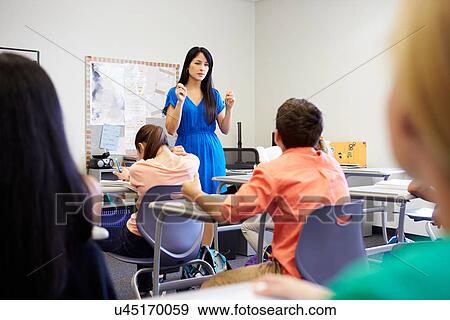 Stock Photo - Female High School Teacher Taking Class. Fotosearch